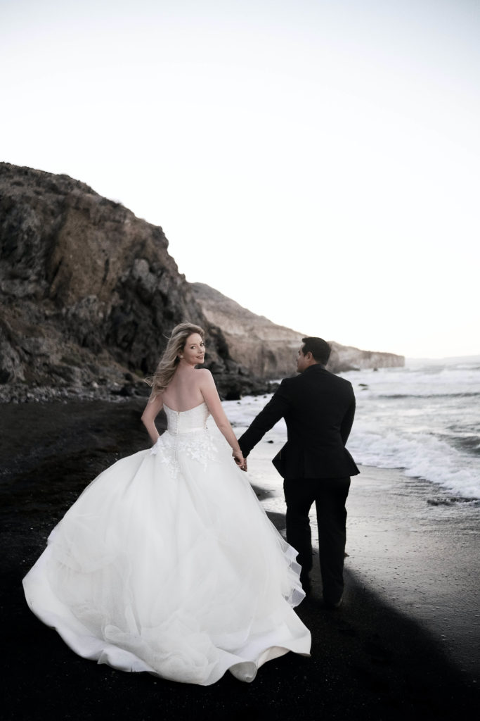 Wedding couple running on the beach