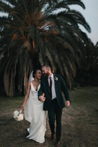 styled shoot photo of bride and groom walking together
