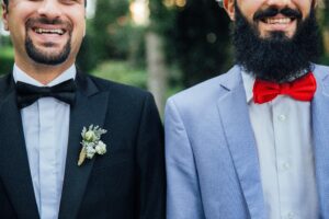 styled shoot of two grooms standing together