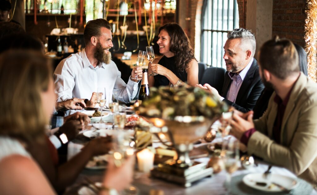 Group of people having their meal for Building Community in the Wedding Industry
