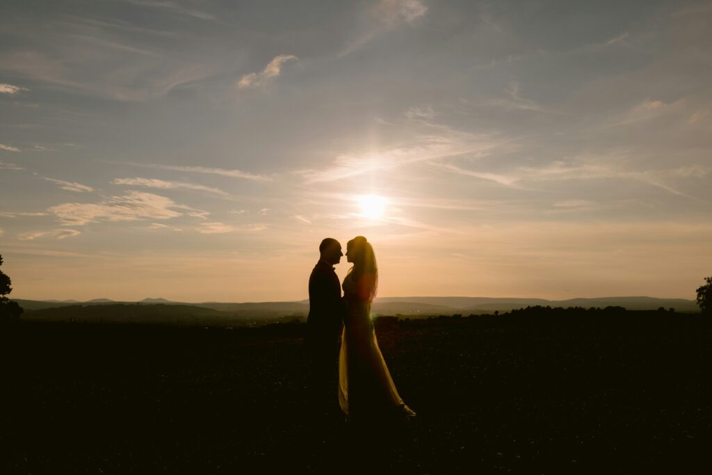 newly wed couple with a sunset view