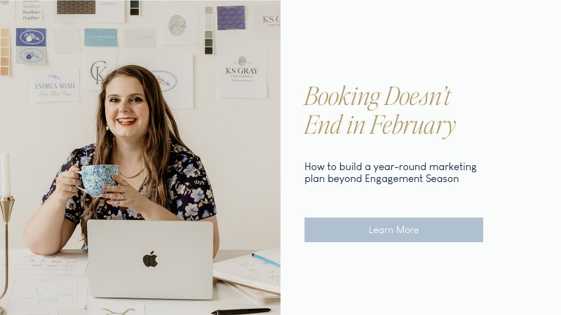 Emily in front of her laptop smiling holding a cup