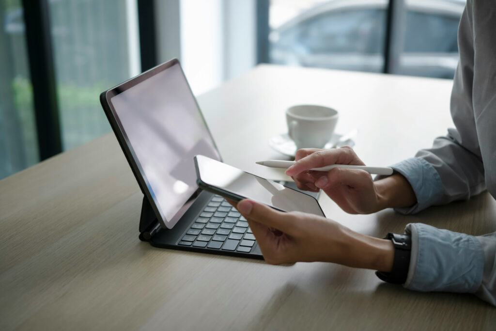 Wedding professional working on tablet at desk