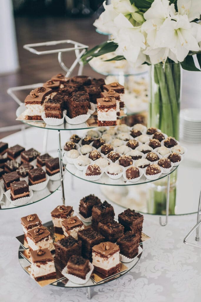 Dessert display with brownies and cupcakes at a wedding reception