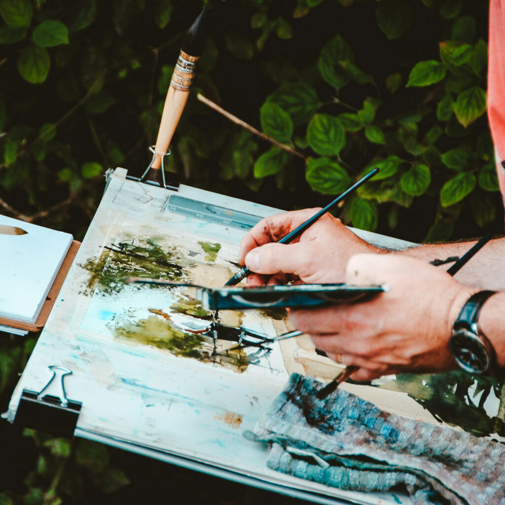 Artist painting outdoors