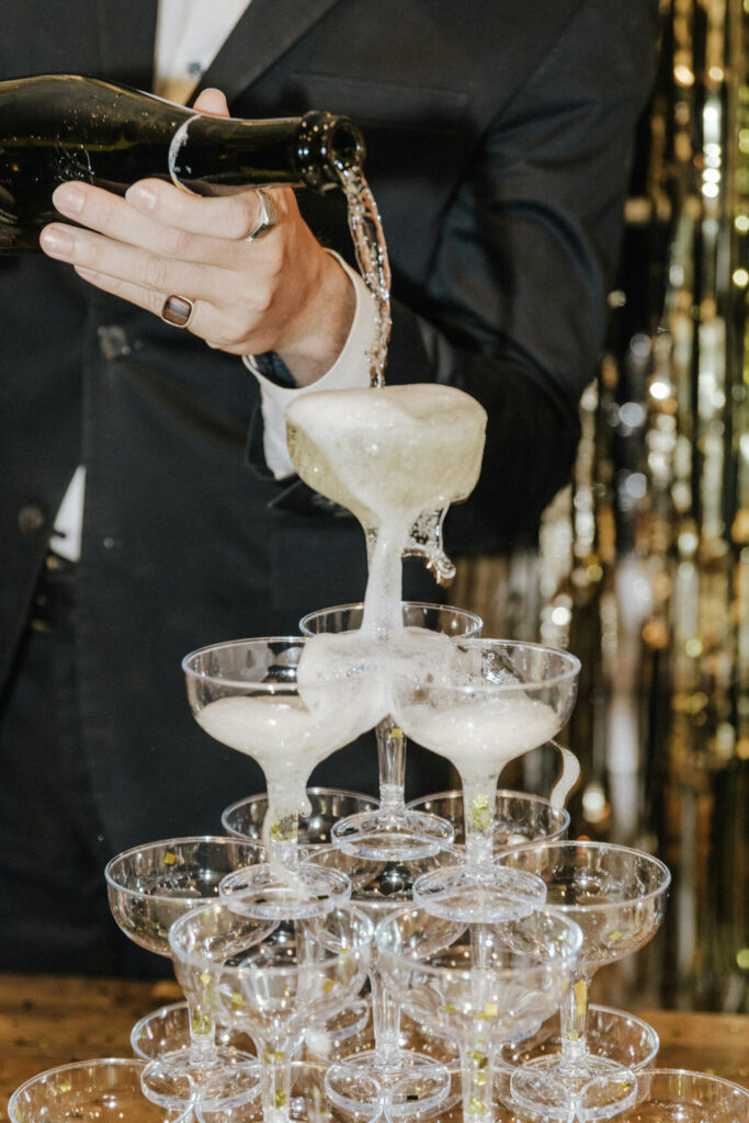 Champagne being poured into a tower