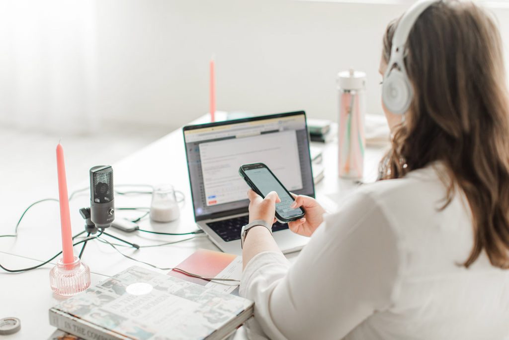 Woman on the computer using the Interact coupon code to build a quiz for a wedding industry brand.