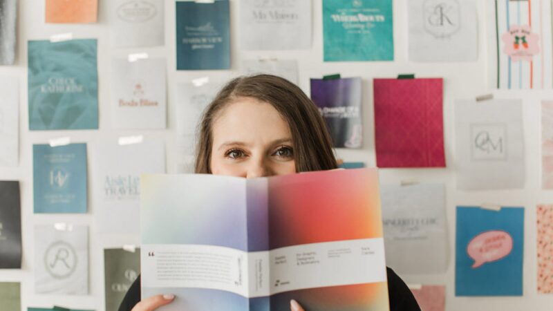 Emily sketching ideas in a notebook