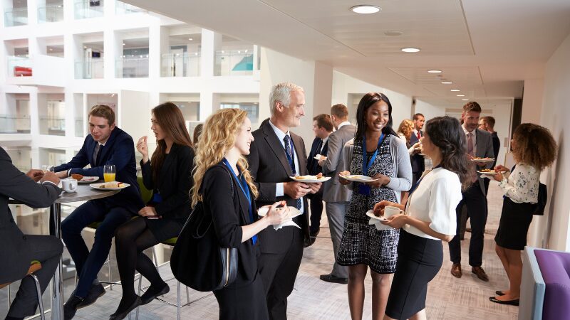 Professionals networking at a business event