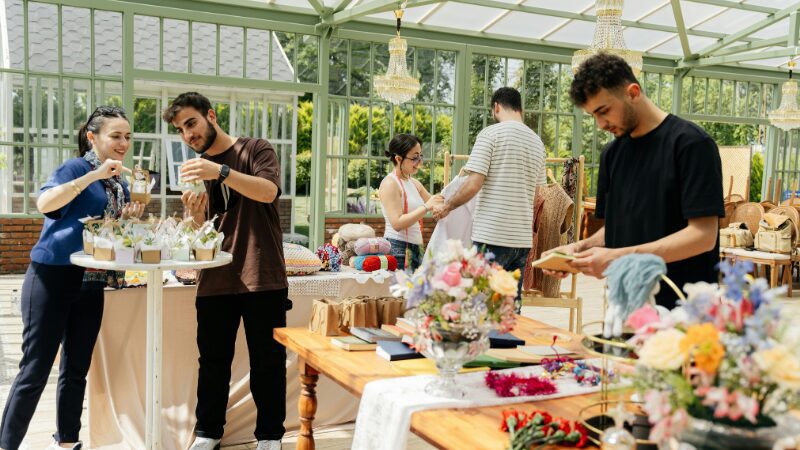 Vendors setting up a creative market display